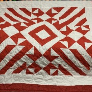 Ručně vyráběný přehoz na postel červený